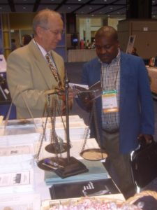 Last time NCSL was in Chicago, 2012, Al Katzenberger explaining Land Value Taxation to an attendee